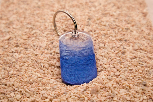 Placa rectangular azul con arena estilo MunBeach. Diseño veraniego original.